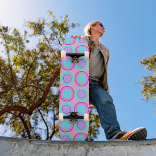 Lilac And Turquoise Doughnuts With Filling On Pink Skateboard