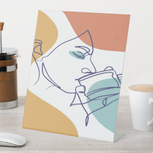 line art drawing poster of woman drinking coffee   pedestal sign