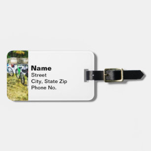 Line of Bicycles in Park Luggage Tag