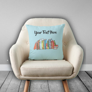 Line of Numerous Colourful Books on Light Blue Cushion