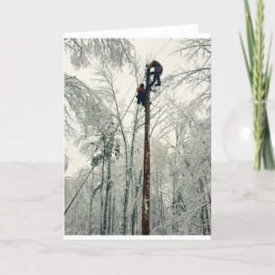 Linemen climbing pole restoring power card