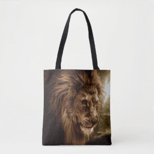 Lion against stormy sky tote bag