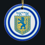 Lion of Judah Emblem Ariel Hebrew Ceramic Tree Decoration<br><div class="desc">Round ceramic ornament with an image,  on both sides,  of a blue and yellow Lion of Judah emblem on white with light blue and dark blue borders and “Ariel” in Hebrew in blue letters above it. See the entire Hanukkah Ornament collection under the HOME category in the HOLIDAYS section.</div>