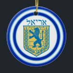 Lion of Judah Emblem Ariel Hebrew Ceramic Tree Decoration<br><div class="desc">Round ceramic ornament with an image,  on both sides,  of a blue and yellow Lion of Judah emblem on white with light blue and dark blue borders and “Ariel” in Hebrew in blue letters above it. See the entire Hanukkah Ornament collection under the HOME category in the HOLIDAYS section.</div>