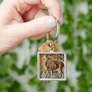 Lion walking in the bushes  key ring