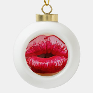 Lips kiss inside christmas ornament