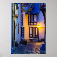 Lit Street Lamp on Cobbled Street