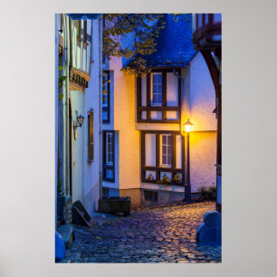 Lit Street Lamp on Cobbled Street Poster