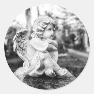 Little angel sitting watching the horizon classic round sticker