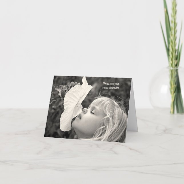 little blond girl sniffing a hibiscus card (Front)