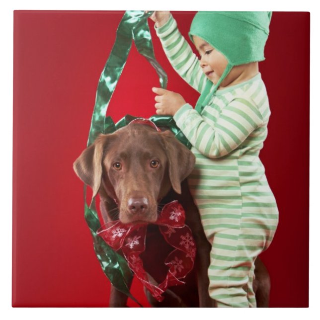 Little boy decorating a dog ceramic tile (Front)