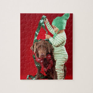 Little boy decorating a dog jigsaw puzzle