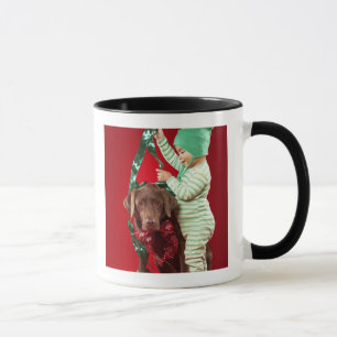 Little boy decorating a dog mug