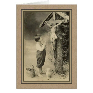 Little Boy praying to Jesus on the Cross