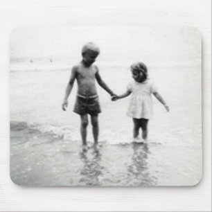 Little girl and boy holding hands mousepad