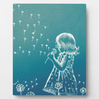 Little girl blowing on a dandelion plaque