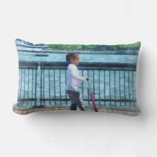 Little Girl on Scooter by Manhattan Skyline Lumbar Cushion