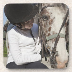 Little girl with her horse coaster