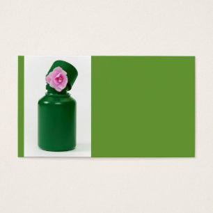 little green bottle and pink flower