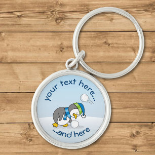 Little penguin getting a snow ball key ring