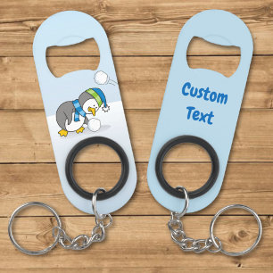 Little penguin getting a snow ball keychain bottle