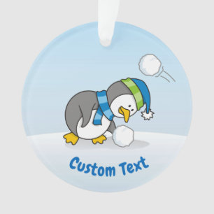 Little penguin getting a snow ball ornament