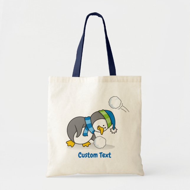 Little penguin getting a snow ball tote bag (Front)