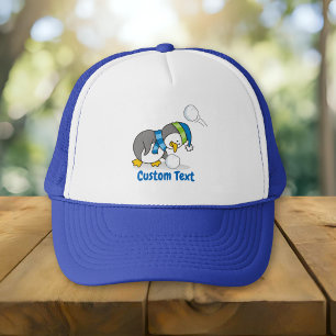 Little penguin getting a snow ball trucker hat