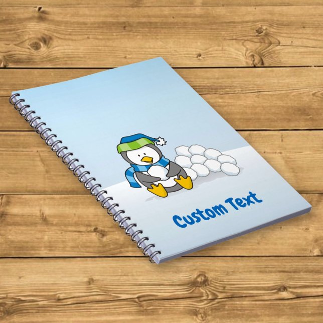 Little penguin sitting with snowballs notebook (Creator Uploaded)