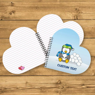Little penguin sitting with snowballs notebook