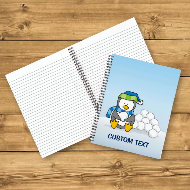 Little penguin sitting with snowballs notebook (Creator Uploaded)