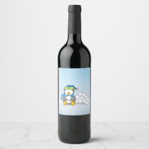 Little penguin sitting with snowballs wine label