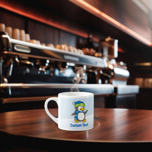 Little penguin walking on snow espresso cup