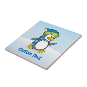 Little penguin walking on snow tile
