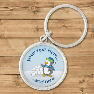 Little penguin with snow balls waving key ring