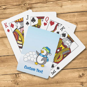 Little penguin with snow balls waving playing card
