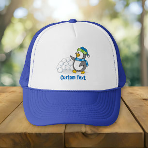 Little penguin with snow balls waving trucker hat