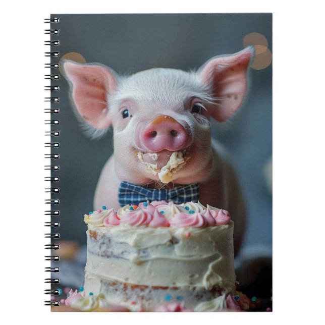 Little piglet munching on a birthday cake notebook (Front)