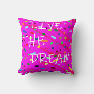 Live the dream pink with white text words patterns cushion