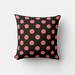 Living coral polka dots on black cushion