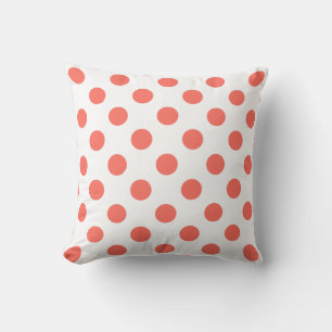 Living coral polka dots on white cushion