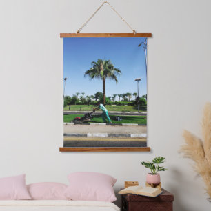 Local resident is engaged in landscaping in Egypt Hanging Tapestry