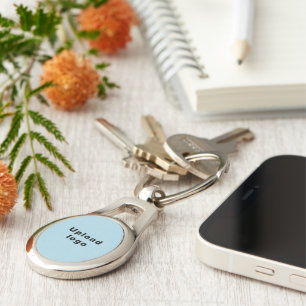 Logo With Light Blue Background on Oval Metal Key Ring