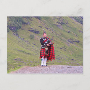 Lone Scottish bagpiper, Highlands, Scotland Postcard