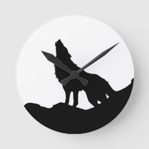 Lone Wolf Standing on a Hill Round Clock