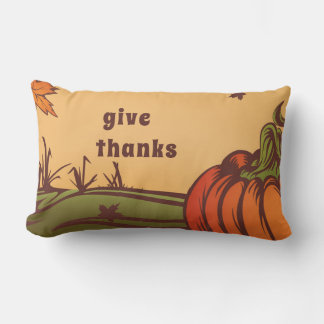 Lonely pumpkin one the field. Autumn leaves fall. Lumbar Cushion