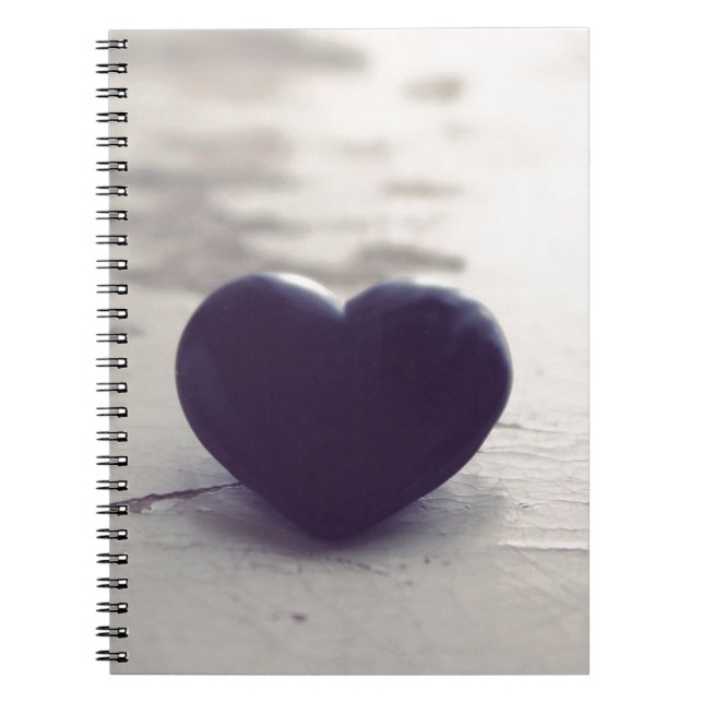 Lonely Purple Stone Heart on a Wet Sandy Beach Notebook (Front)
