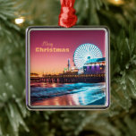 Los Angeles Pink Blue Ferris Wheel Beach Sunset Metal Ornament<br><div class="desc">"Merry Christmas" Santa Monica's Pacific Wheel Sunset (Pacific Park) Pink and Blue: This photograph was taken in Santa Monica,  Los Angeles,  California. Use my image,  or swap it for your own,  this is a great photo to decorate your dorm or bedroom with!</div>
