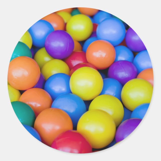 Lots of colourful plastic balls classic round sticker (Front)