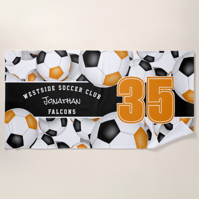 Lots of soccer balls orange black team colours beach towel (Front)